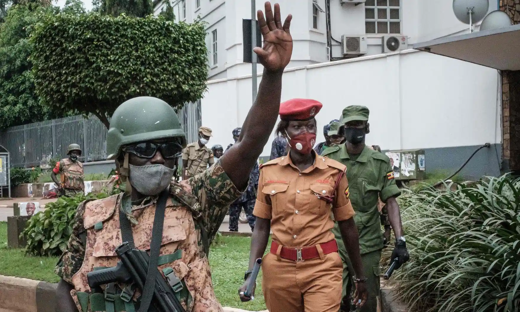 Officers patrolling in a street in a Kampala suburb before January’s presidential election results were announced. Photograph: Yasuyoshi Chiba/AFP/Getty Images